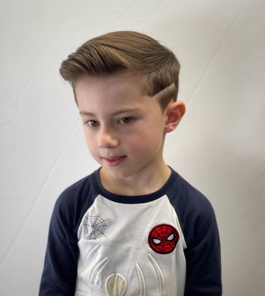 A modern and edgy haircut with a shaved design on one side.
